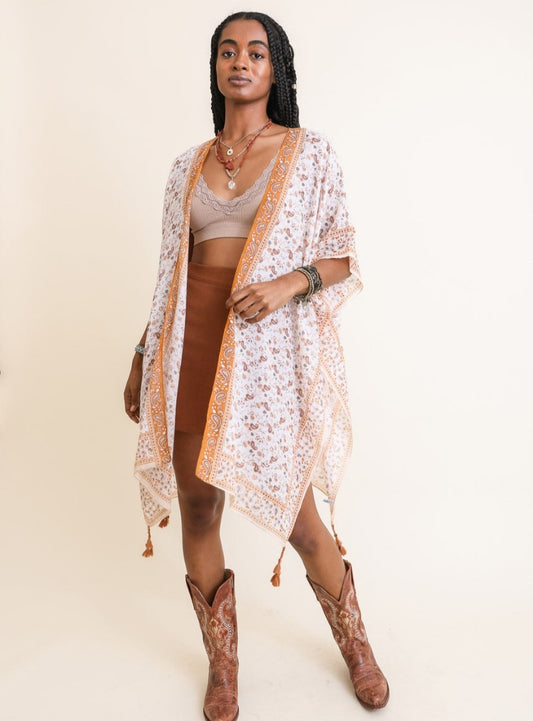Lightweight sheer kimono with bohemian patterns in yellow and orange.