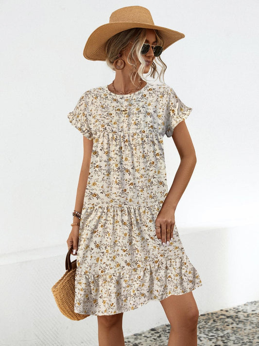 Summer's charm in a dress! Discover our Floral Tiered Dress, perfect for day/night elegance. Available in black and sand.
