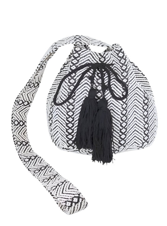 Front view of Aztec Jacquard Boho Swing Bucket Bag with black tassel accents.