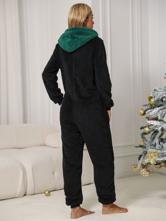 Adorable women’s onesie featuring pom-pom accents and side pockets