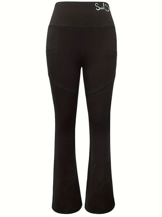 Black high-rise bootcut yoga pants for women, front view.