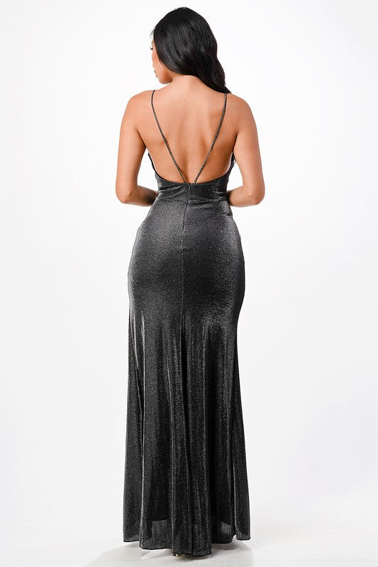 Back view of a black mermaid gown with a zipper closure and full length.