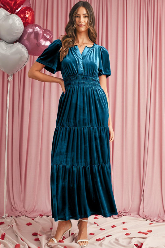 Luxurious blue velvet maxi dress with pockets and flattering waist detail