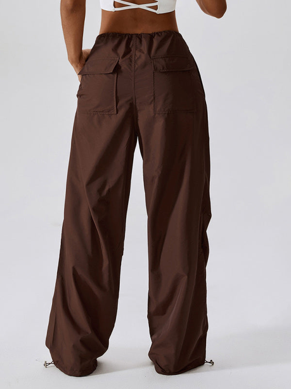 Back shot of brown casual athletic pants with a drawstring waistband and straight-leg fit.
