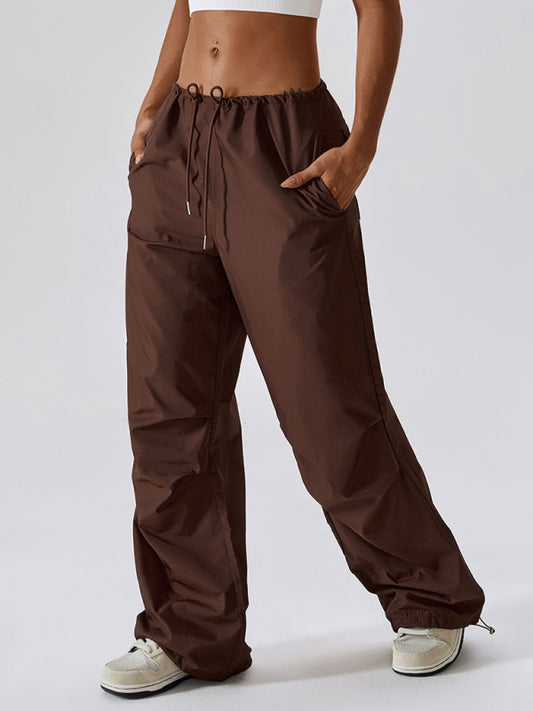 Front shot of brown casual athletic pants with a drawstring waistband and straight-leg fit.