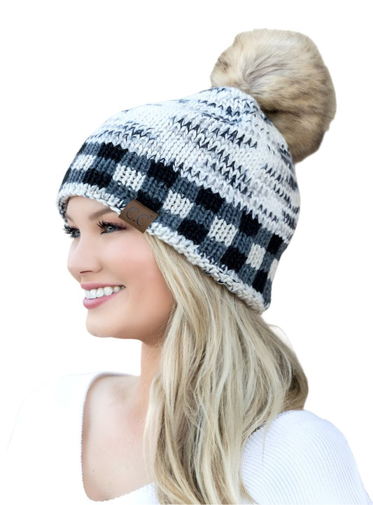 Ivory and black buffalo plaid beanie with faux fur pom and cozy knit design