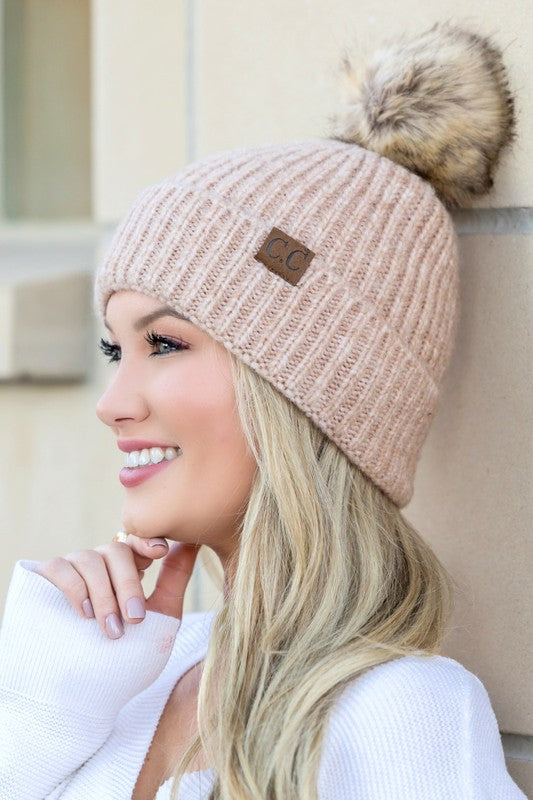 Oatmeal CC cozy beanie featuring a marled knit and fluffy pom accent