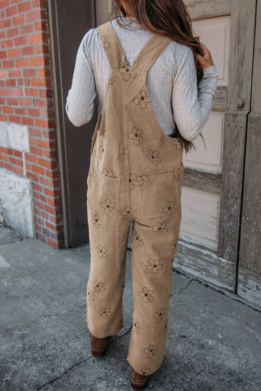 Women’s pocketed corduroy overalls featuring a whimsical flower design.