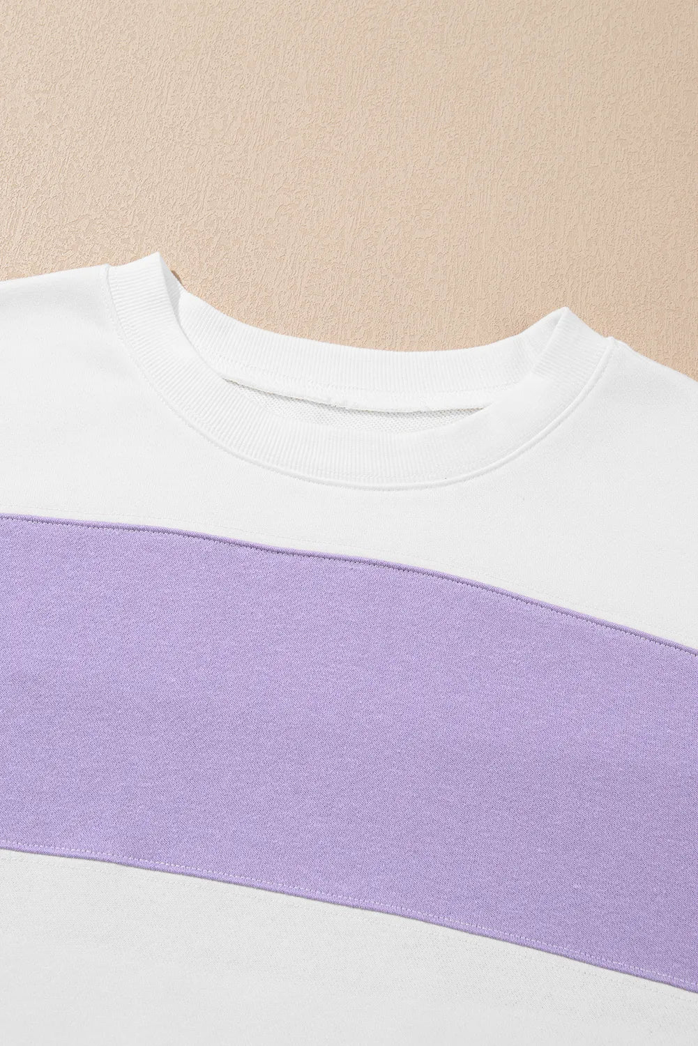 Pastel color block crewneck sweatshirt with oversized fit for casual wear.