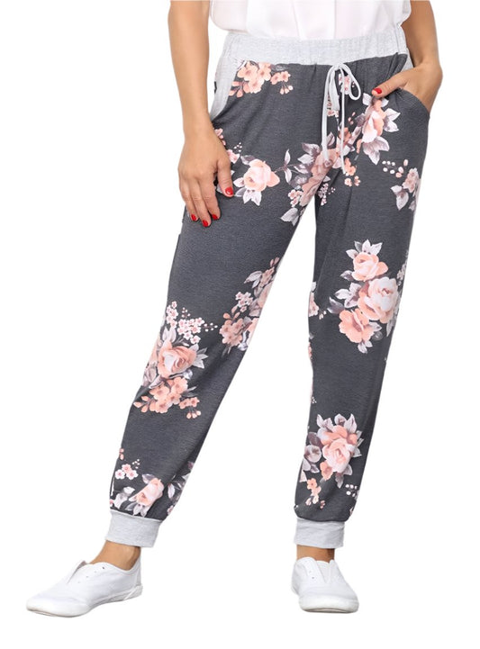 Front view of floral drawstring jogger pants in charcoal with blush flowers
