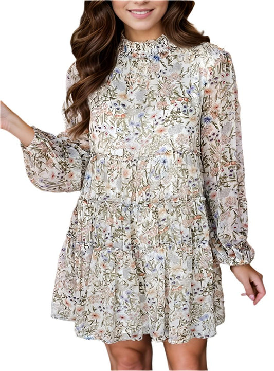 Front view of a floral tiered smock dress with a high neckline and balloon sleeves.