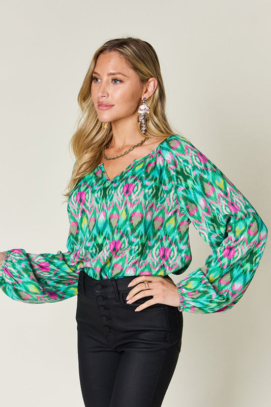 Stylish V-neck Ikat blouse in green with a lightweight feel.