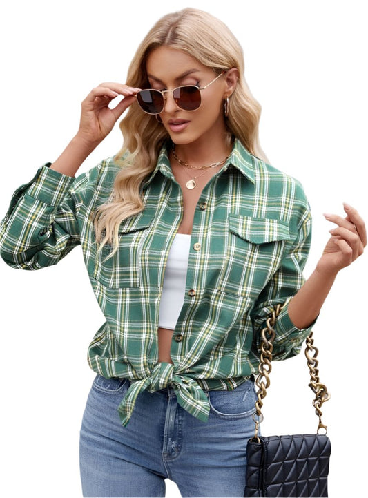 Green plaid button-up shirt styled casually with high-waisted jeans.