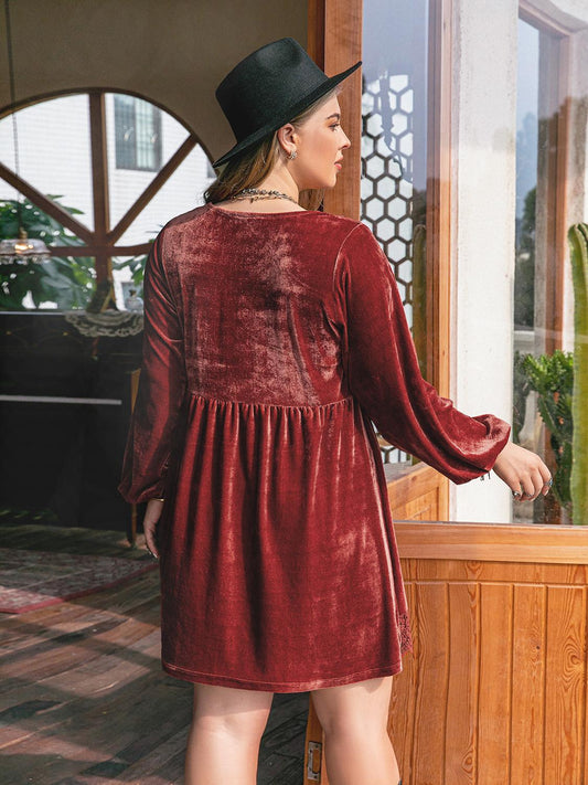 back view of reddish brown dress with lace hem