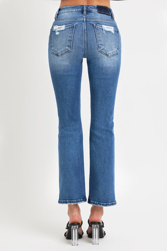 Back view of RISEN mid-rise ankle jeans showing pocket details.