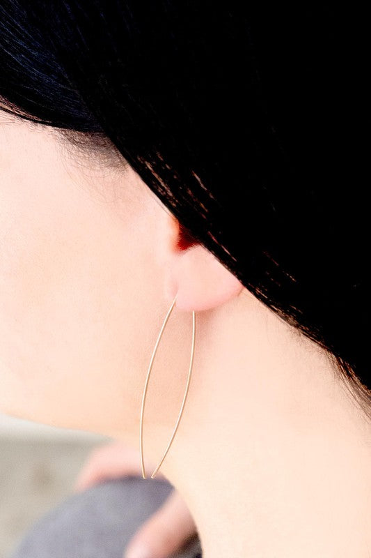 Side view of Rose Gold Arc Threader Earrings highlighting their minimalist aesthetic.