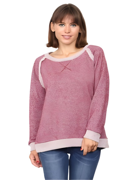 Woman wearing a burgundy shimmer French terry top, perfect for casual days.