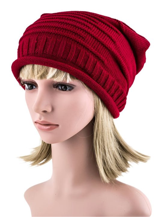 Comfortable red beanie featuring dimensional knit texture