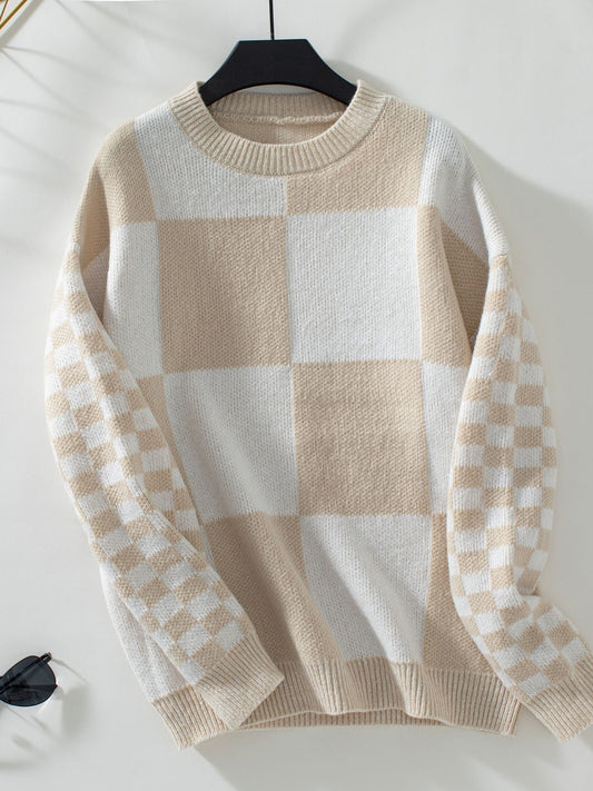 Casual tan and white checkerboard sweater for a chic, modern look.