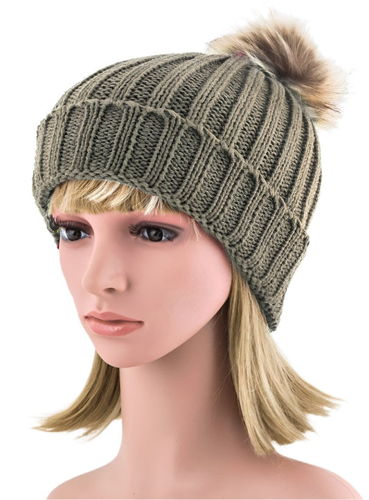 Ribbed knit beanie in taupe with a cozy faux fur pom accent.