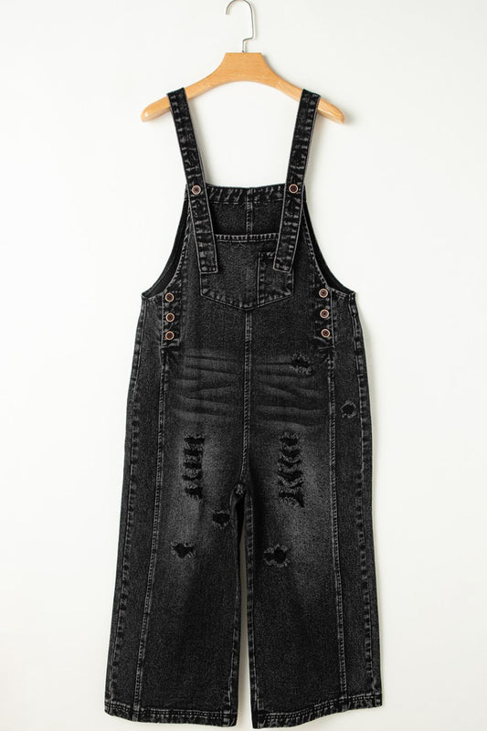 Comfortable women’s black denim overalls with a relaxed, roomy fit.