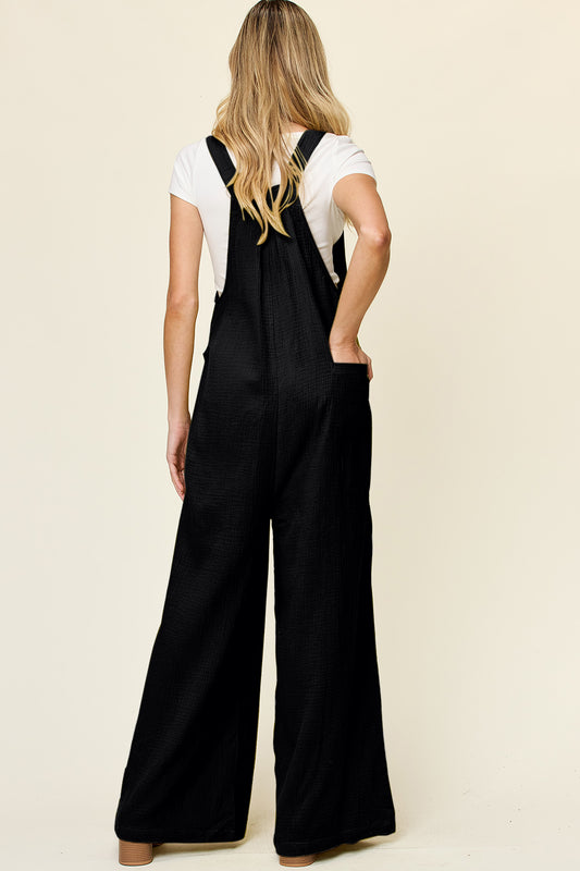 Flowy textured wide-leg overalls for women, perfect for casual outings.