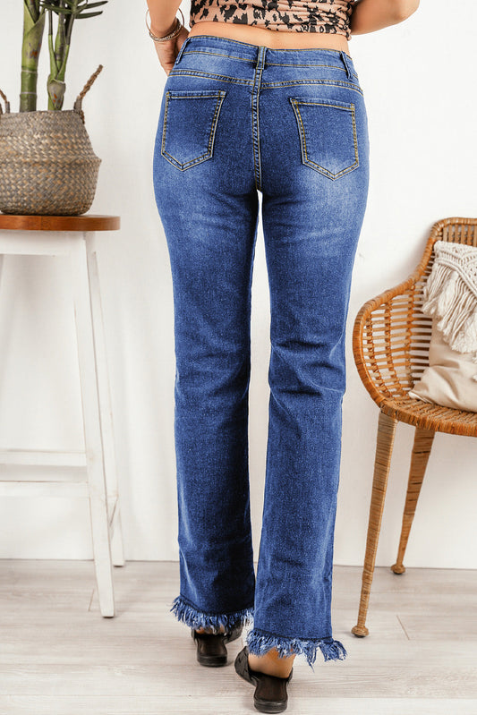 Back view of high waist raw hem straight jeans with functional pockets.
