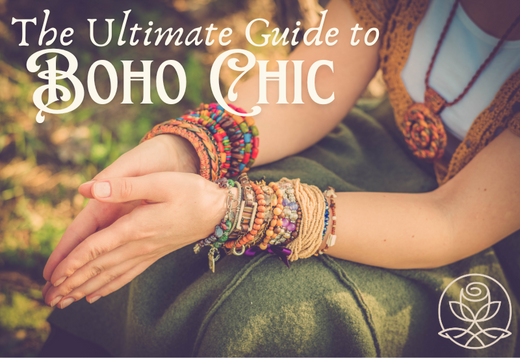 Image of a woman's hands adorned with multiple colorful bracelets and accessories, resting on a green fabric. The text "The Ultimate Guide to Boho Chic" is displayed prominently at the top, with a subtle floral logo in the bottom right corner.