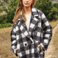 Chic boucle plaid coat for women, featuring side pockets and a lapel neck.
