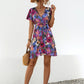 Shop the Printed Surplice Tie Waist Mini Dress – perfect blend of elegance, comfort, and vibrant style for any spring occasion.