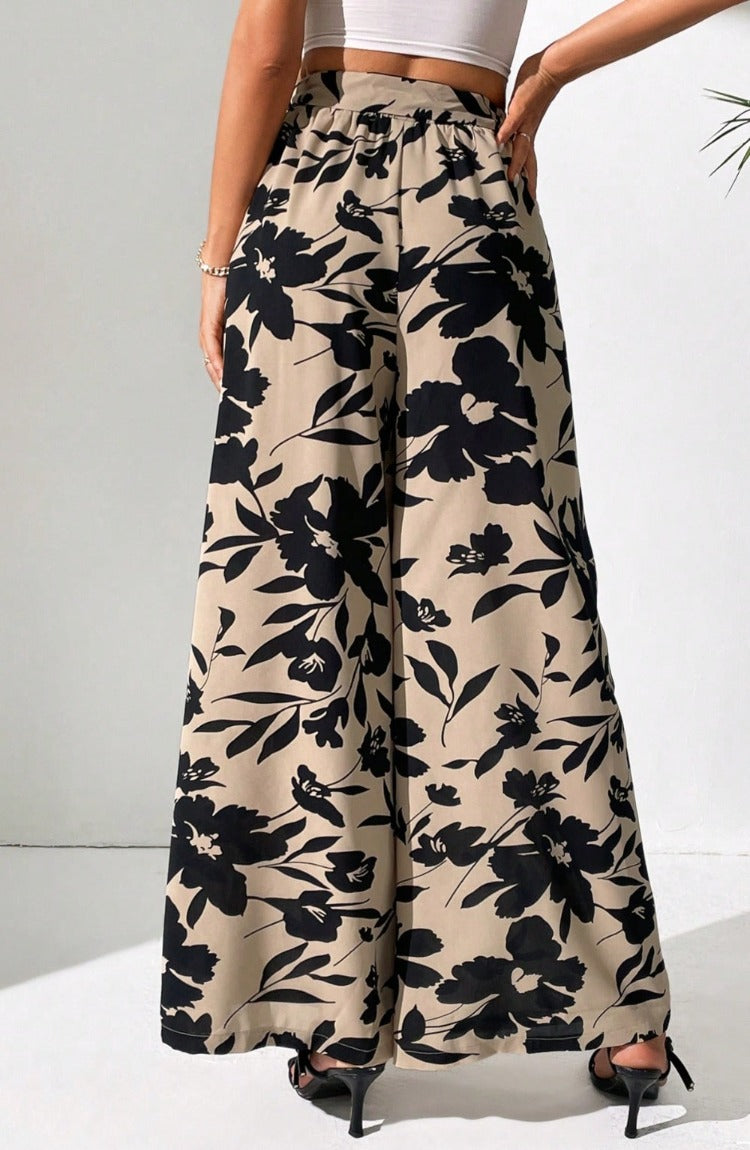 Upgrade your style effortlessly with our Printed Tied Wide Leg Pants. Chic, comfortable, and versatile - perfect for any occasion. Shop now!