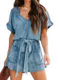 Chic denim romper with notched neckline and adjustable tie waist for a perfect fit. Versatile, comfortable, and perfect for summer days.