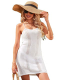 White bathing suit cover up with crisscross straps and halter neck