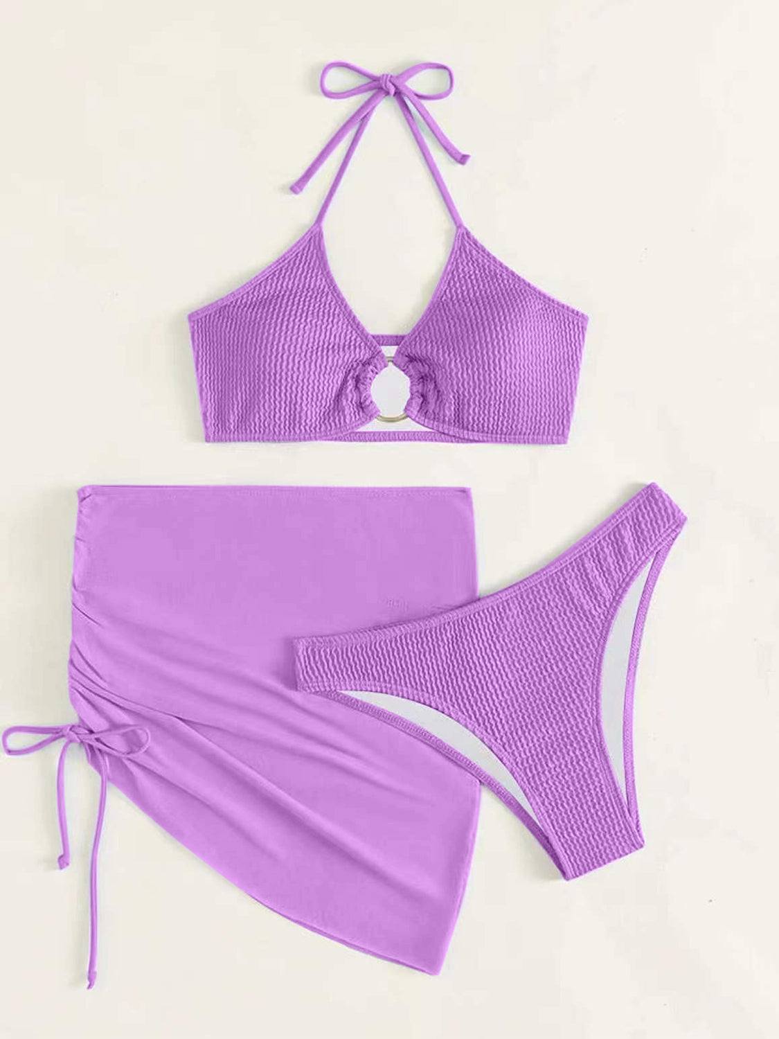 Embrace summer with our chic Tied Halter Neck Swim Set. Adjustable, stylish, and perfect for any beach day or poolside escape.