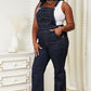 Women's dark blue denim overalls with a straight leg design