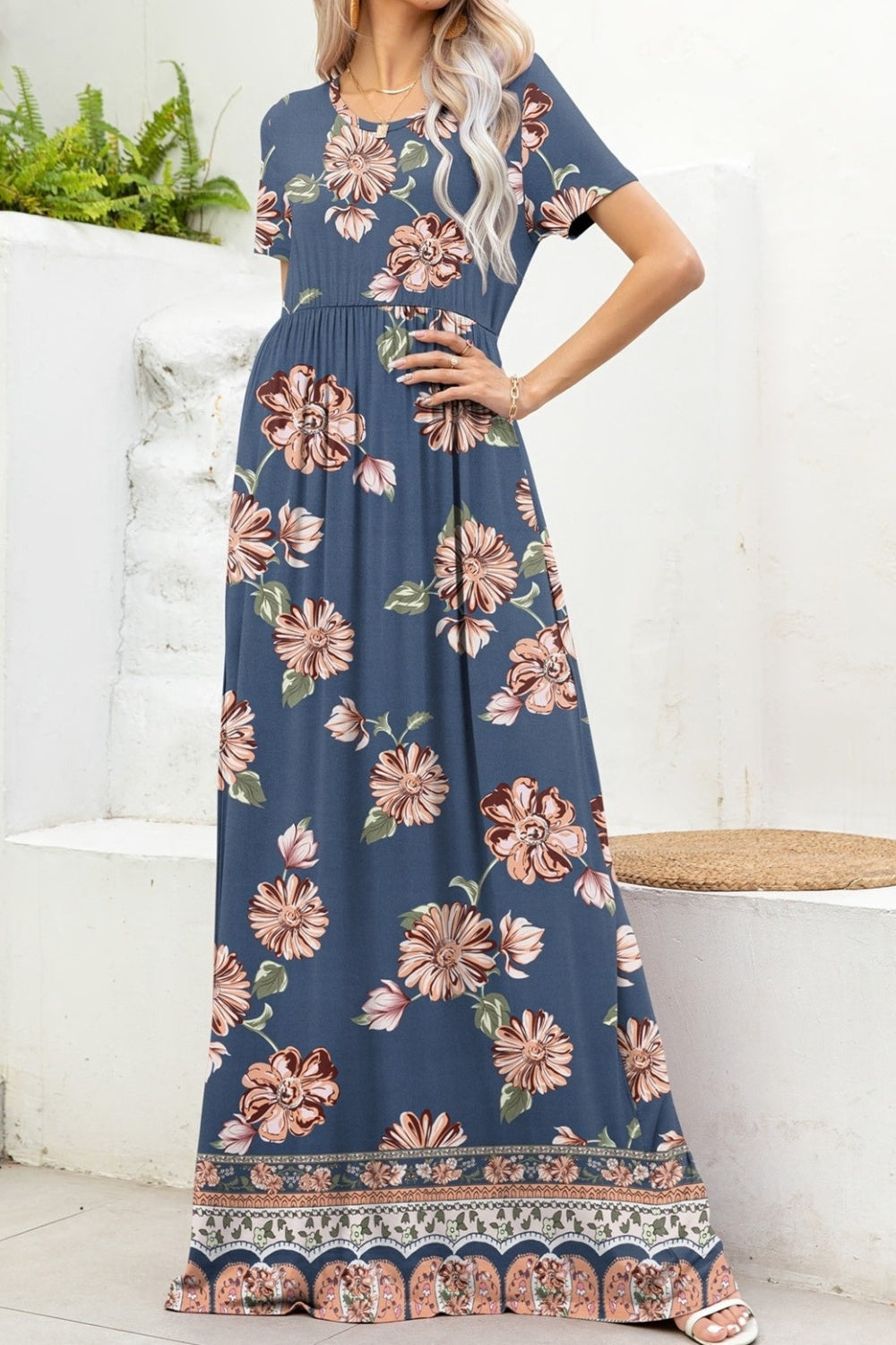 Elegant blue maxi dress with intricate floral and geometric designs