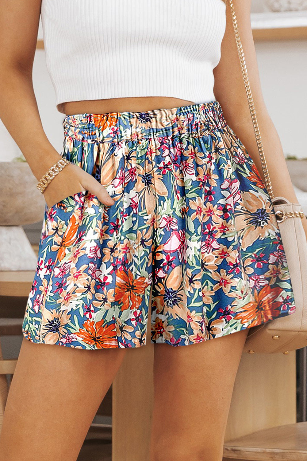 Stylish Floral High Waist Shorts with pockets perfect for summer. Light fabric, vibrant colors, and versatile design for any occasion.
