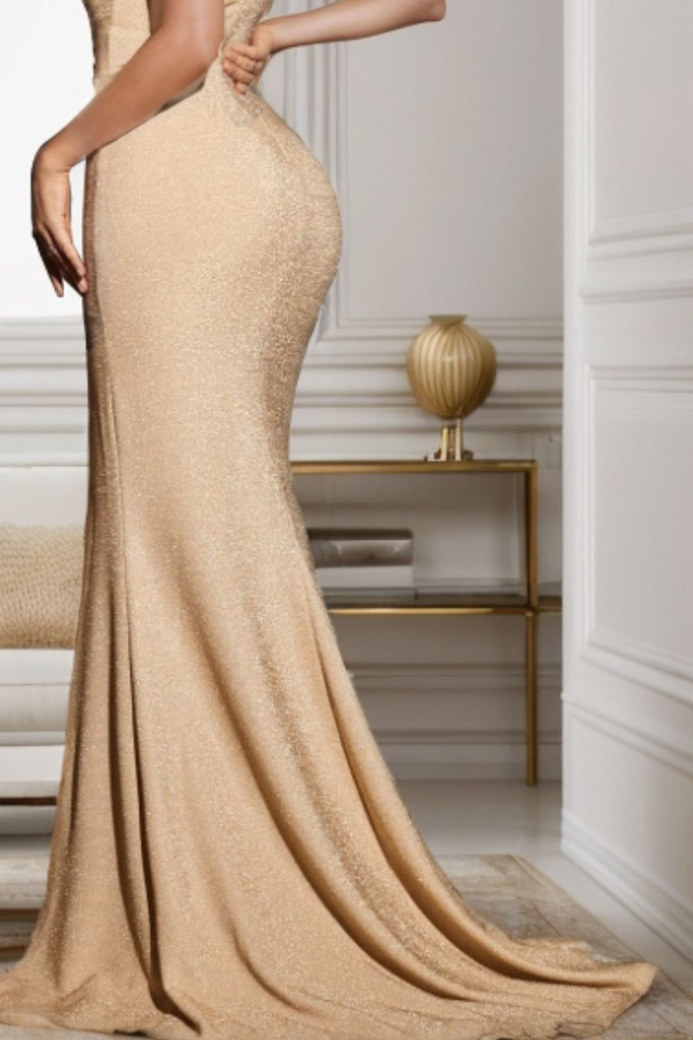Elevate your evening look with our gold Slit Square Neck Dress, designed for elegance with a seductive slit and flattering square neckline.