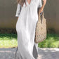 White maxi dress with a flattering V-neck and practical side pockets.