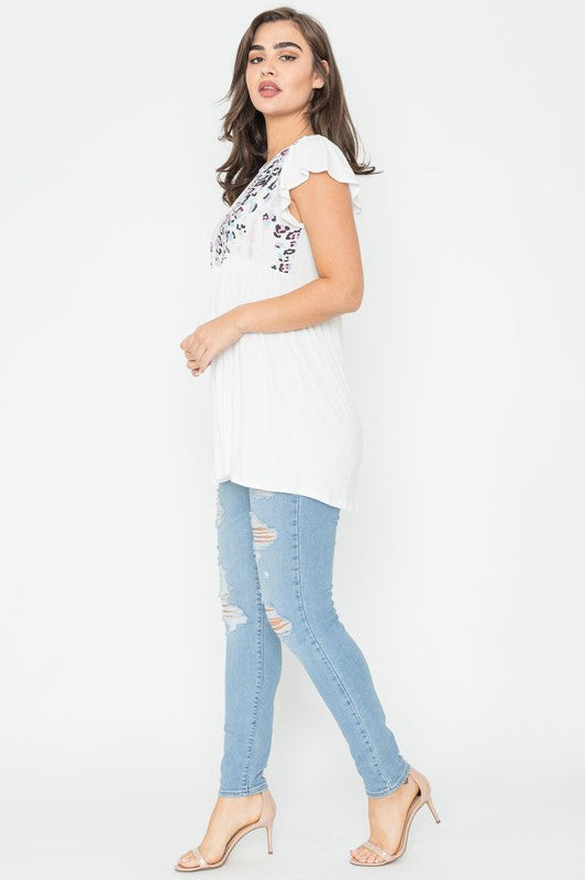 White flowy blouse with leopard print