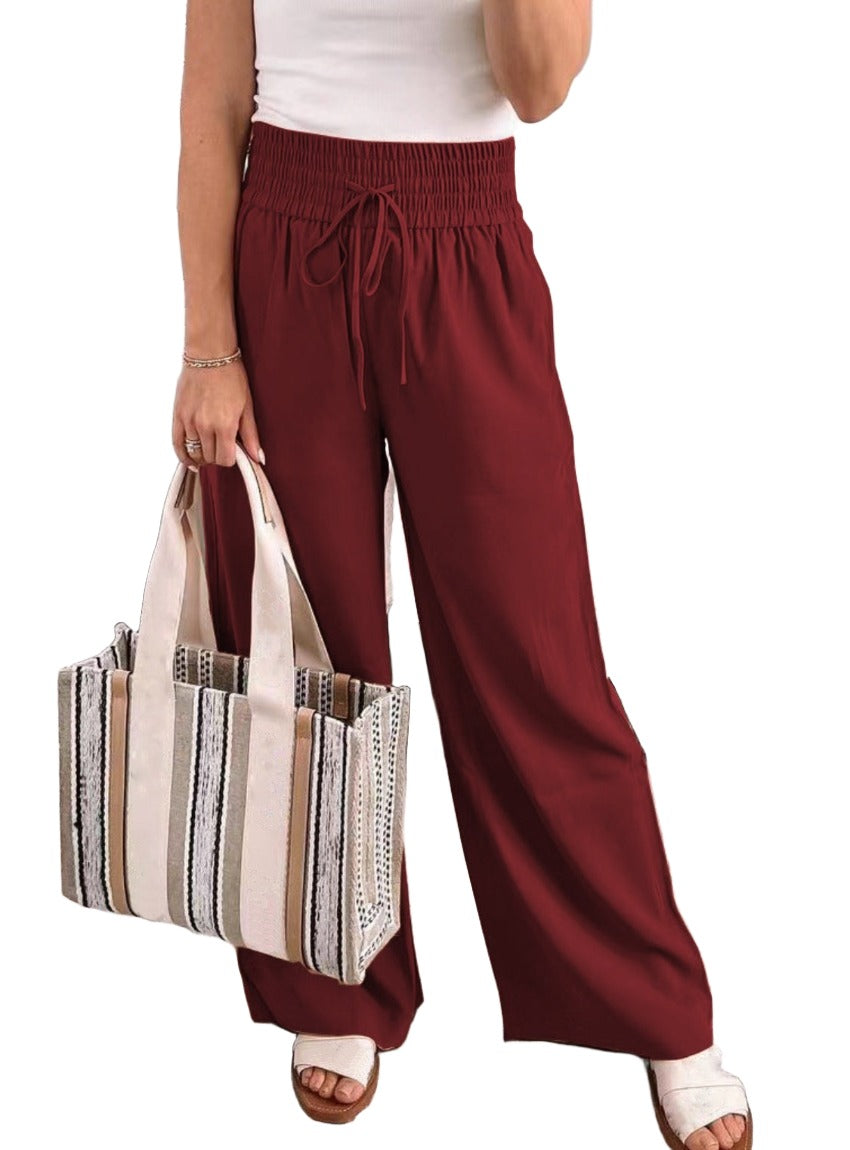 Wide-leg pants available in six colors with an elastic waistband and drawstring.