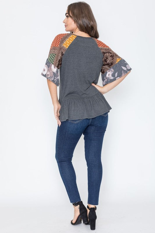 Charcoal gray blouse with colorful, patterned sleeves