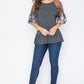 Charcoal gray peplum top with decorative sleeves