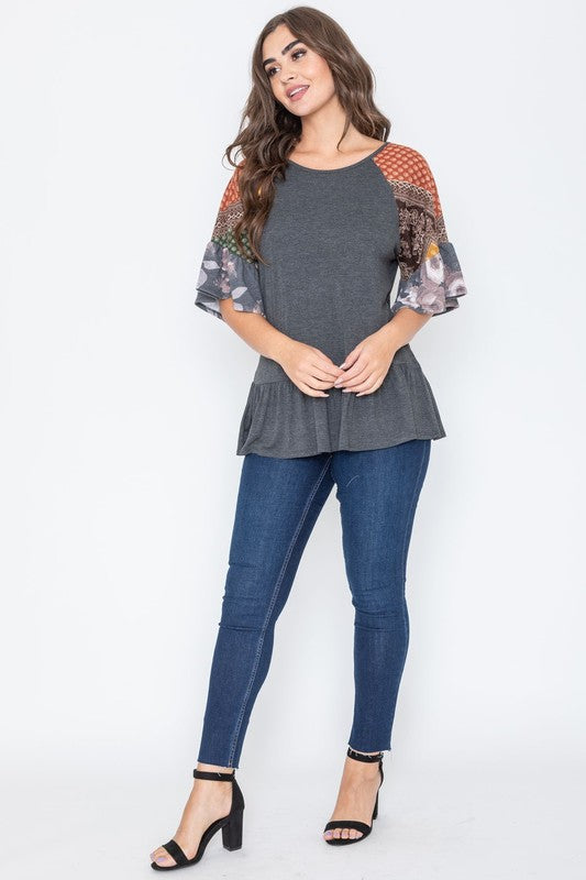 Charcoal gray peplum top with decorative sleeves