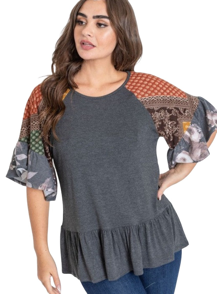 Charcoal gray peplum top featuring multi-patterned sleeves