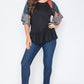 Black patchwork peplum top with colorful sleeves