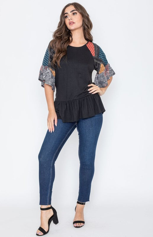 Black patchwork peplum top with colorful sleeves