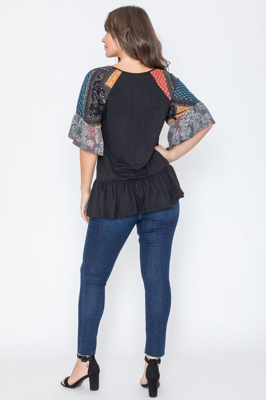 Black peplum blouse showcasing boho-chic sleeve design