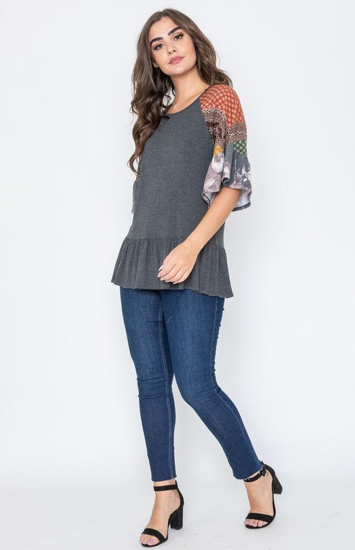 Charcoal gray peplum blouse with vibrant patchwork details