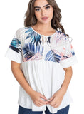 Colorful tropical leaf print top with short sleeves and tie-neck feature.